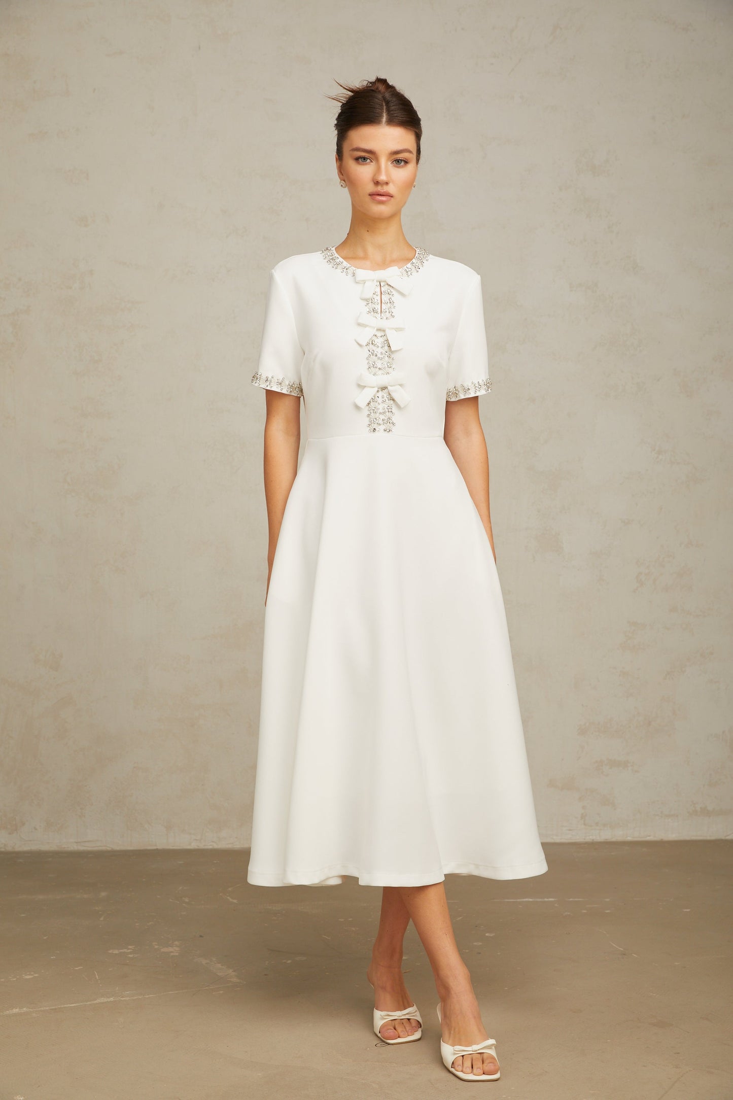 Cassiopeia crystal-accented bow midi dress in White