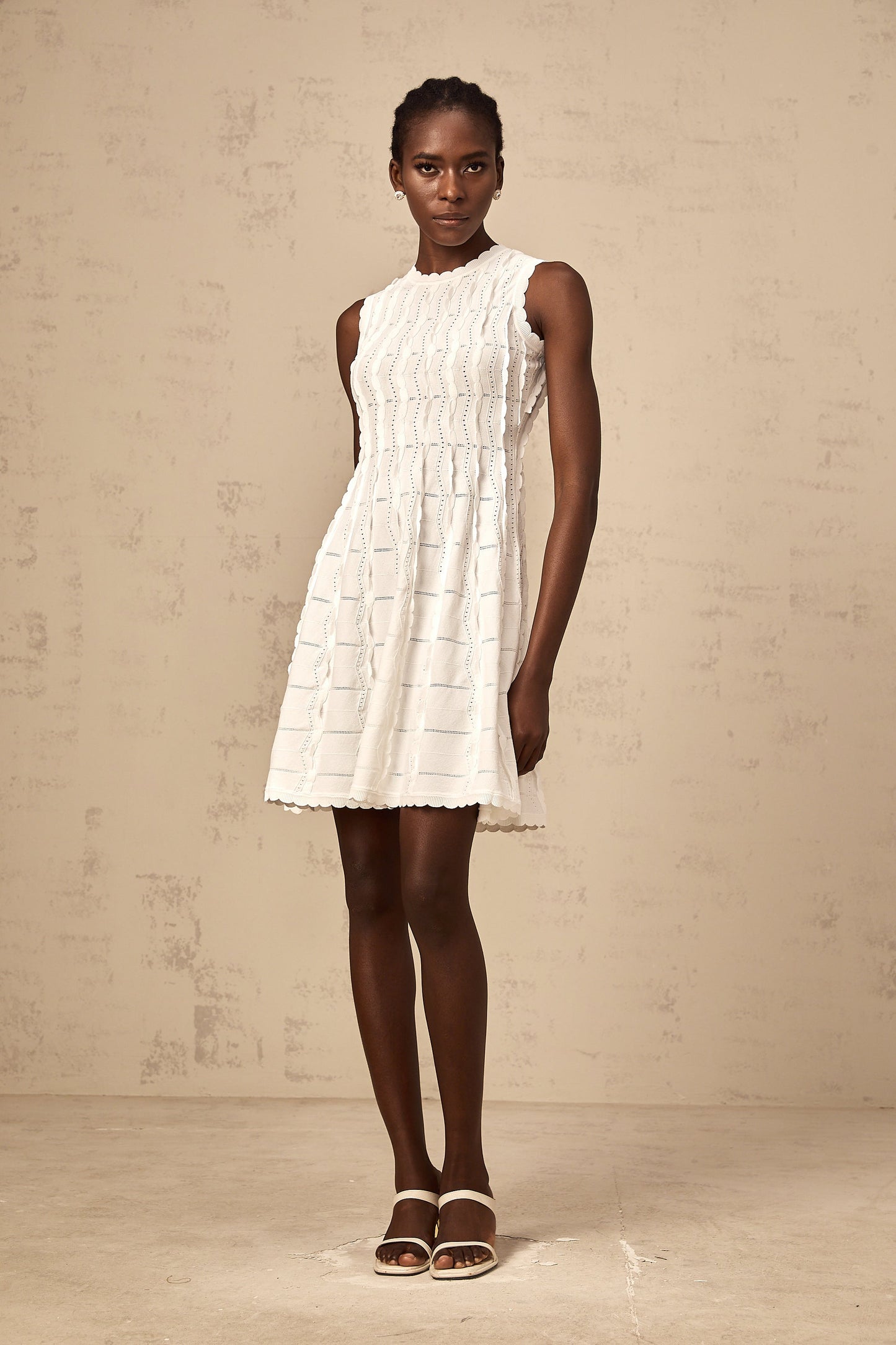 Esmée white ruffled sleeveless knit mini dress