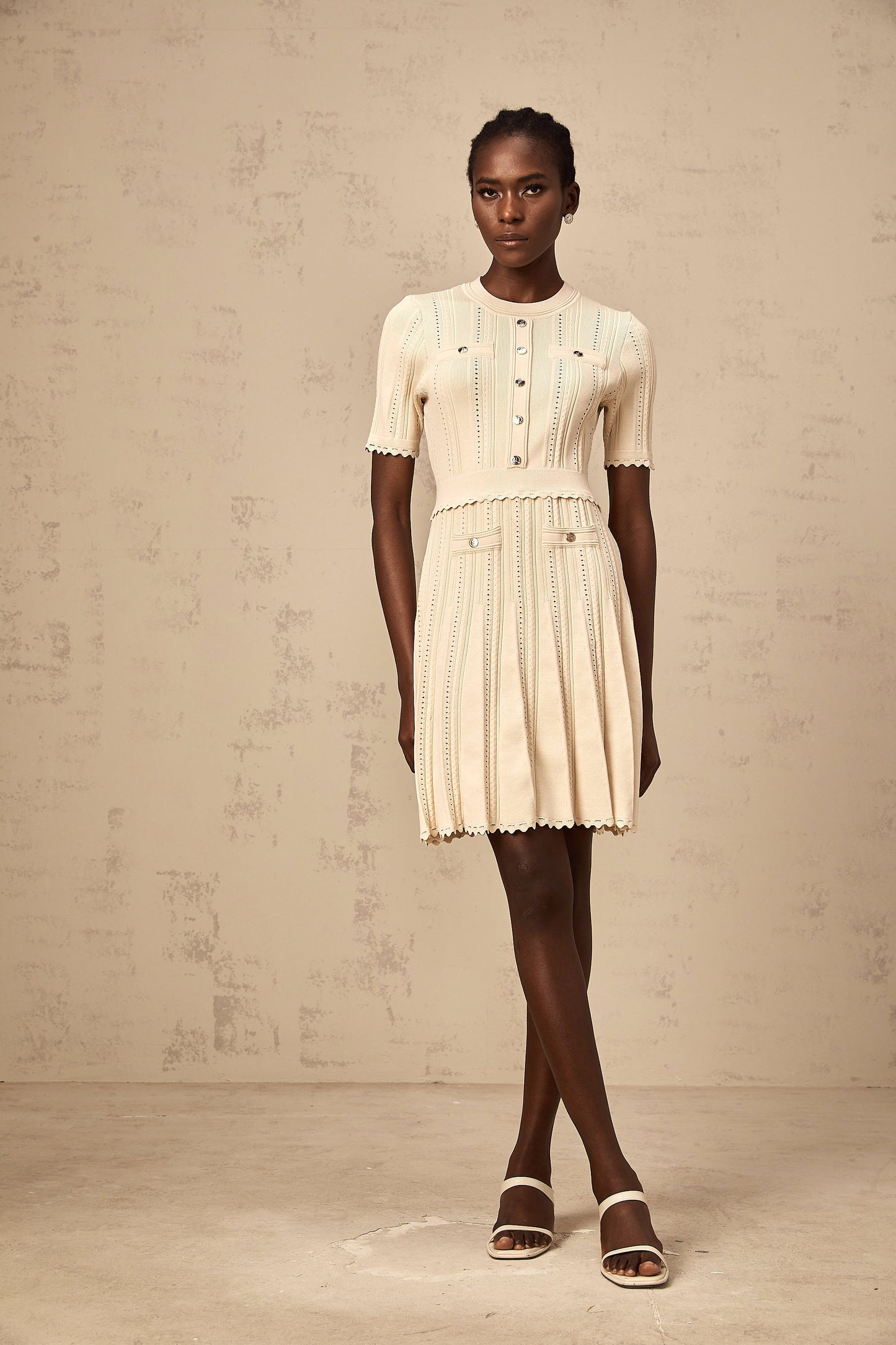 Amélie neutrals pointelle-trim pleated knit mini dress