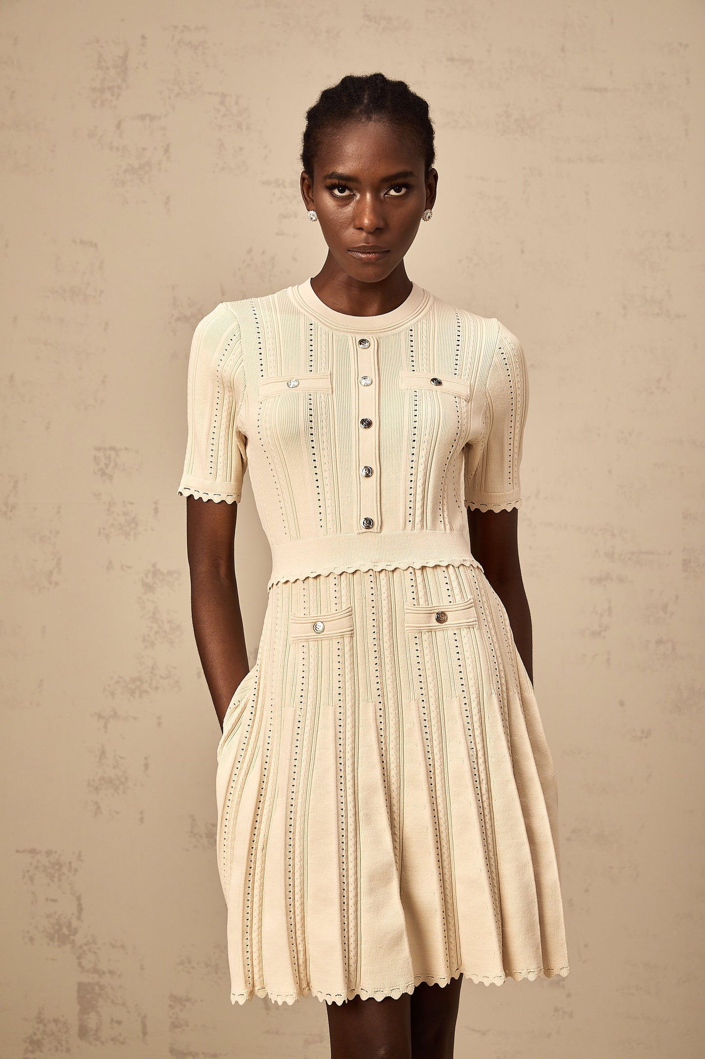 Amélie neutrals pointelle-trim pleated knit mini dress