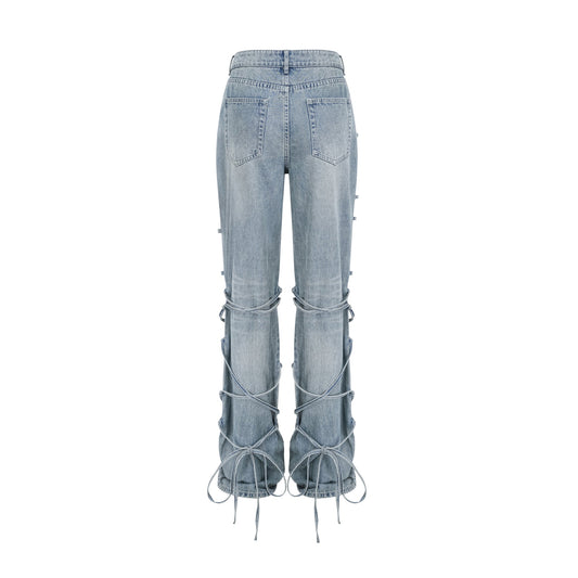 Géraldine strap-detail jeans