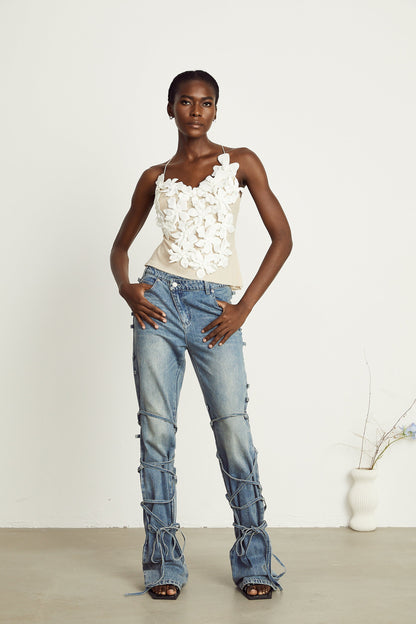 Géraldine strap-detail jeans