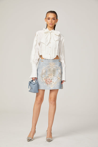 Céleste white pleated scarf-collar shirt