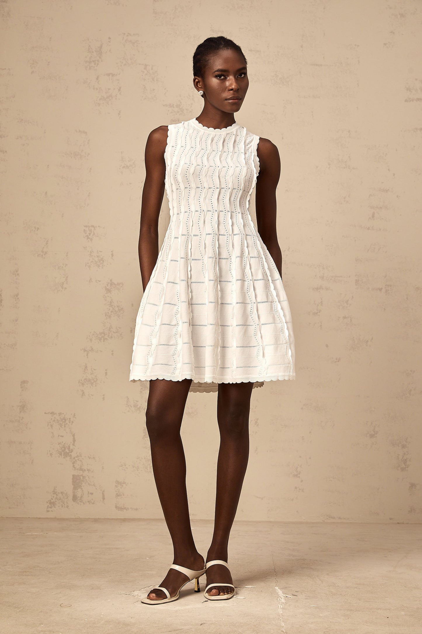 Esmée white ruffled sleeveless knit mini dress