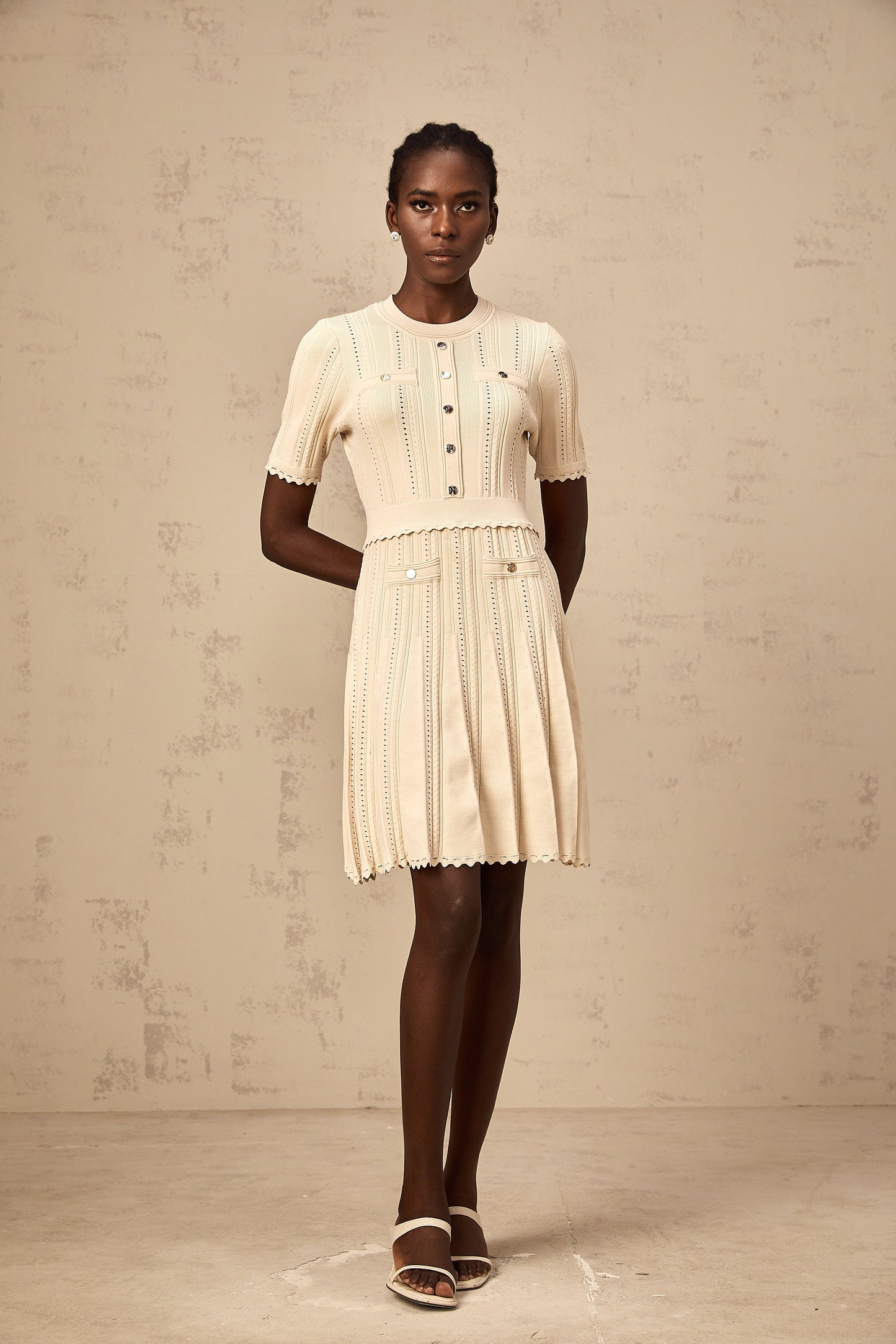Amélie neutrals pointelle-trim pleated knit mini dress
