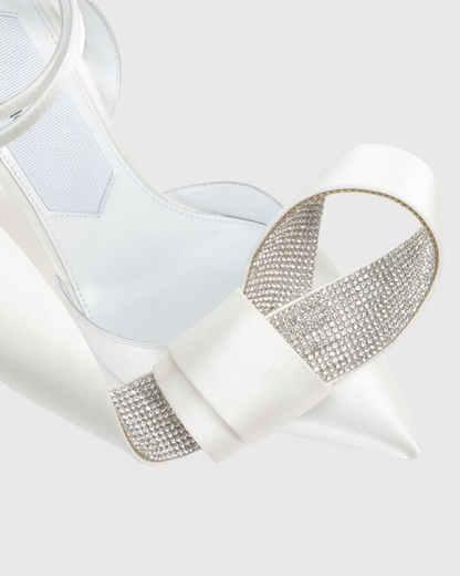 Crocifissa Spiral Rhinestone Bow Pumps In White