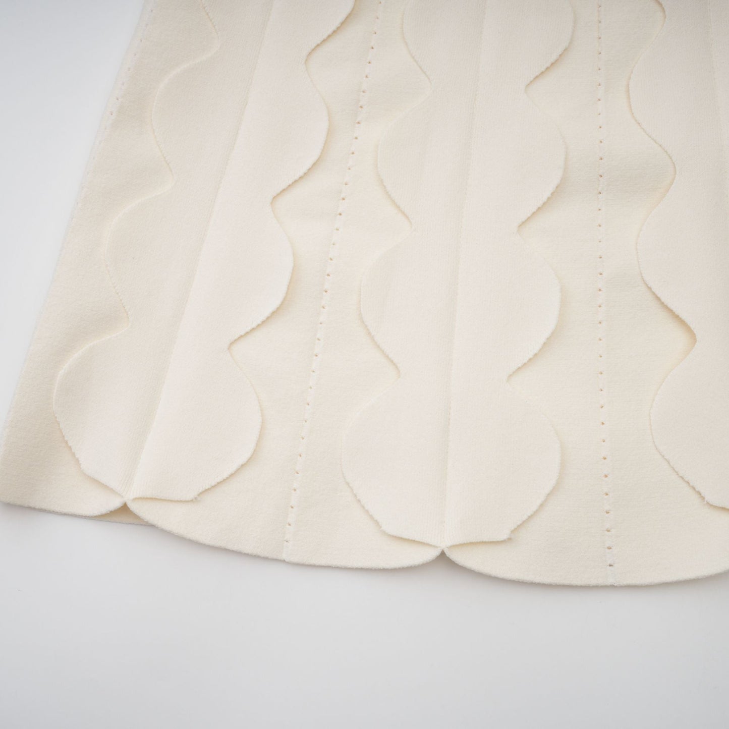 Axelle white wavy-detail sleeveless mini dress