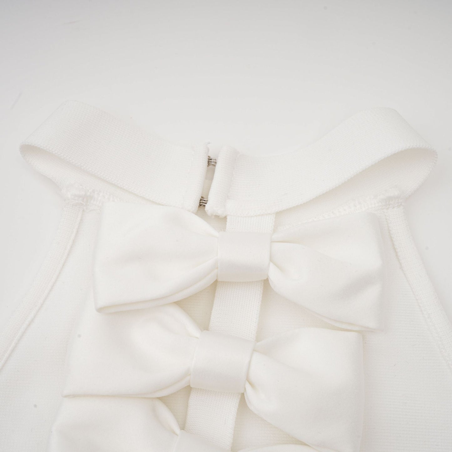 Capucine white oversize-bow bandage dress