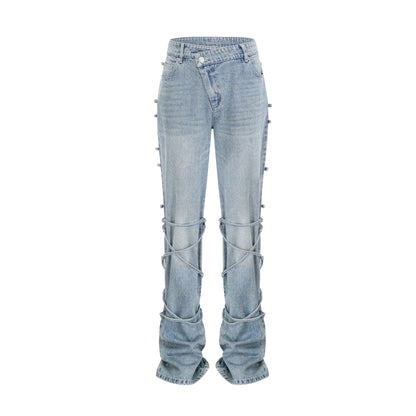 Géraldine strap-detail jeans