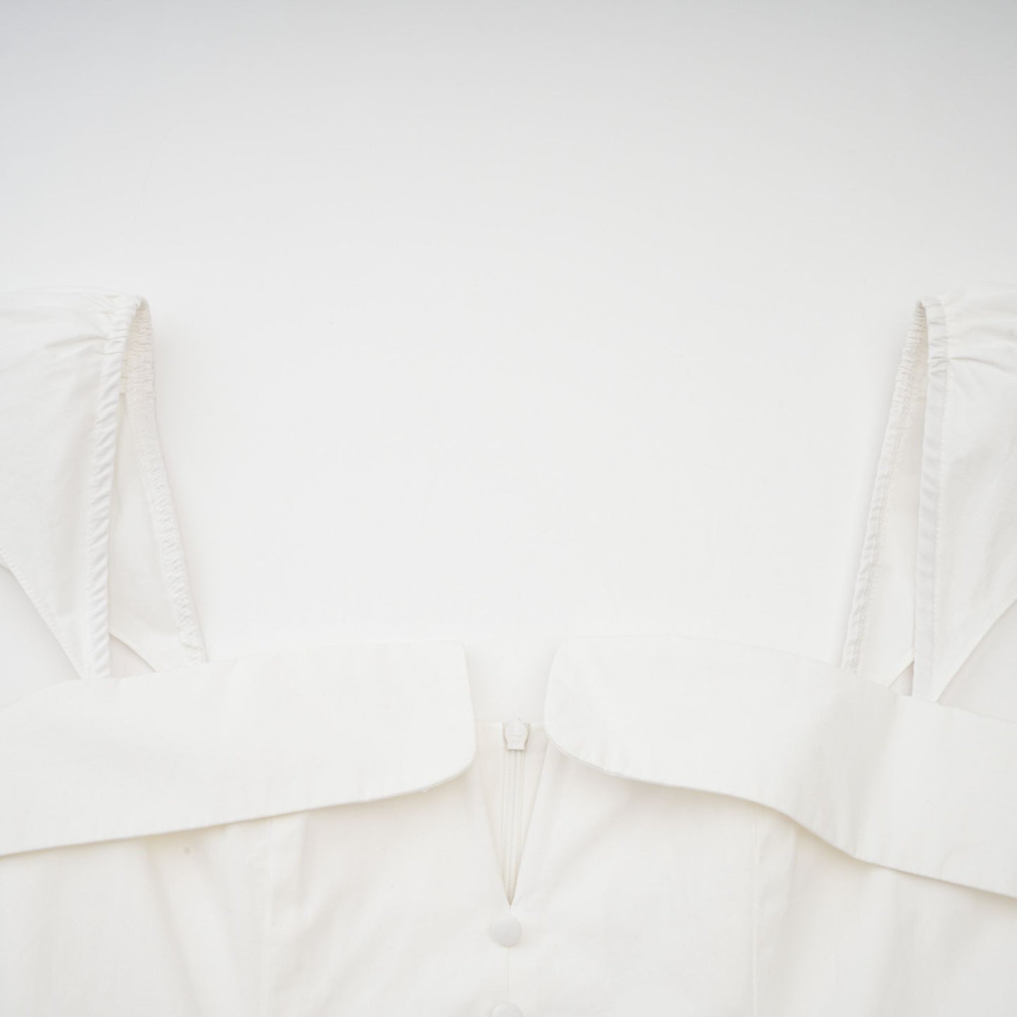 Julie white folded-neck bonded sleeveless mini dress