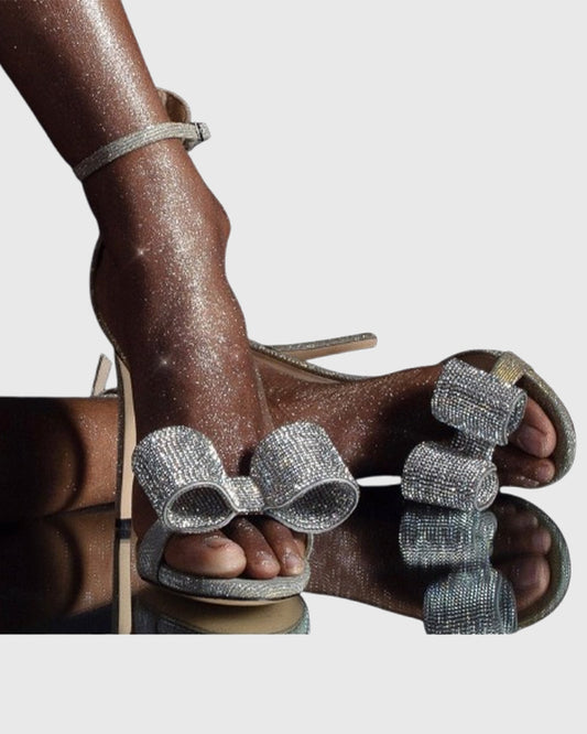 Ines Crystal Bow Sparkle Sandals In Silver