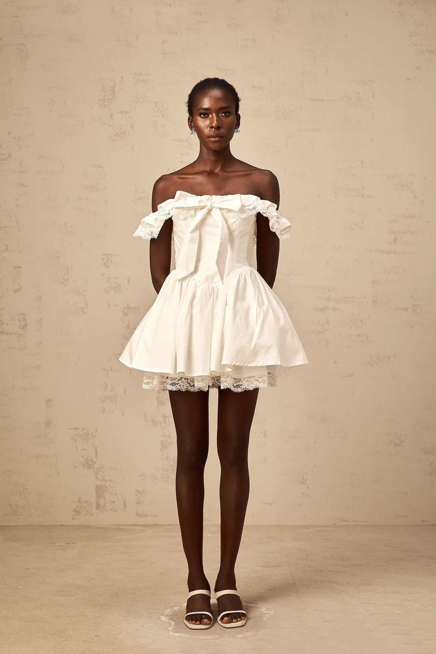 Arsène white oversize-bow ruffled mini dress